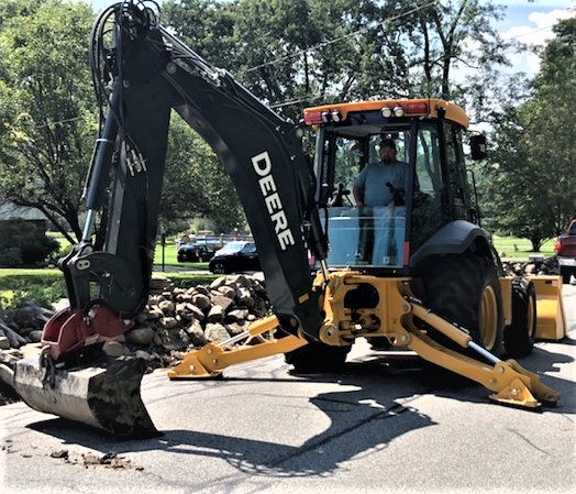 Highway Department utilizing a Deere appliance